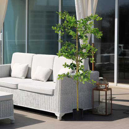 Stylish artificial tung tree plant in a modern patio setting next to a white sofa