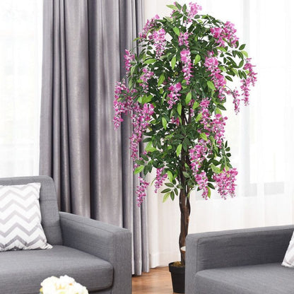 Lifelike artificial wisteria tree in a stylish living room with pink flowers and green leaves