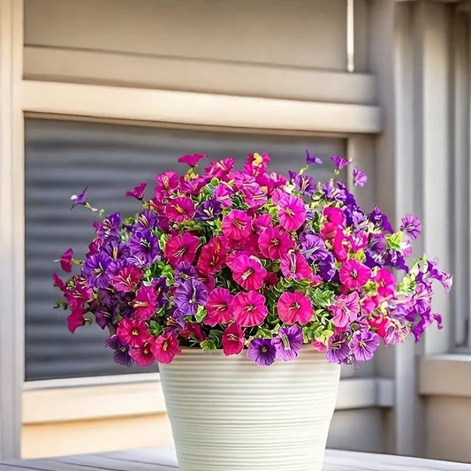Bright artificial flowers for home in a white pot with vibrant pink and purple blossoms from FauxMart.com
