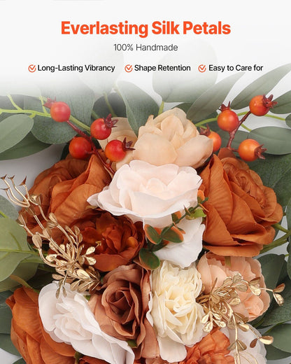 Burnt orange wedding arch flowers with silk petals including cream and brown roses with green leaves and orange berries