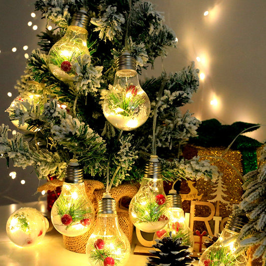 Battery powered Christmas string lights with decorative bulbs featuring greenery and red berries on a frosted Christmas tree