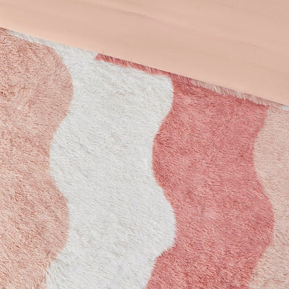 Ombre faux fur comforter set with soft textured waves in shades of pink and white
