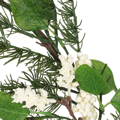 Close-up of eucalyptus Christmas garland with green leaves and white berry clusters decoration
