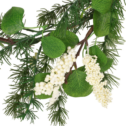 Close-up of green leaves and white berries on a eucalyptus Christmas garland from FauxMart.com