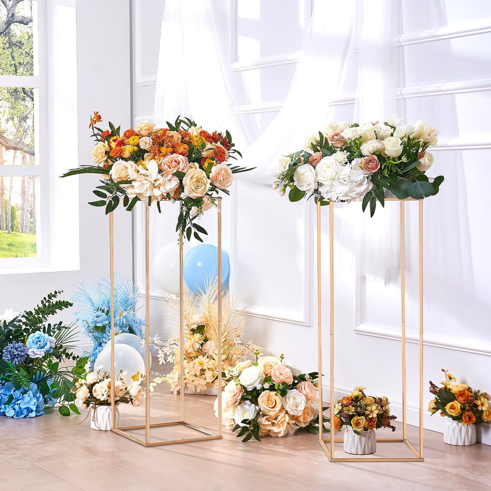 Elegant gold wedding flower stand featuring a variety of colorful roses and greenery for event decor