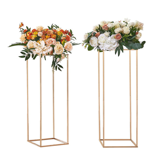 Gold wedding flower stand pair with beautifully arranged floral displays for elegant events