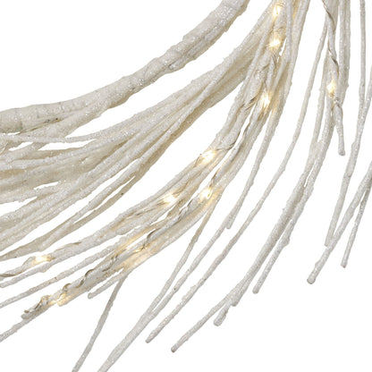 Close-up of lighted paper wreath strands with glowing warm white lights and textured design