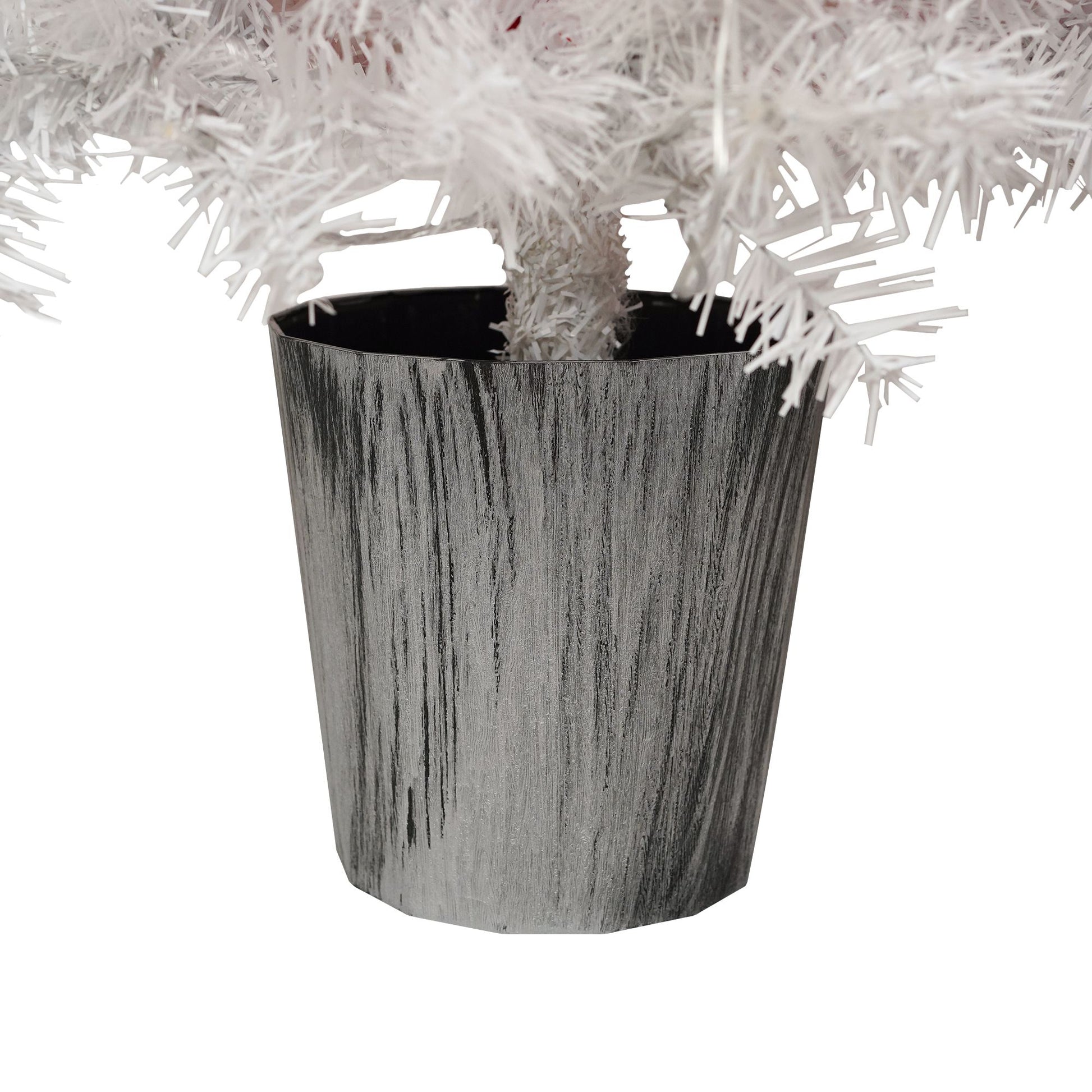 Close-up of silver tree stand base for lighted santa hat christmas tree with white branches