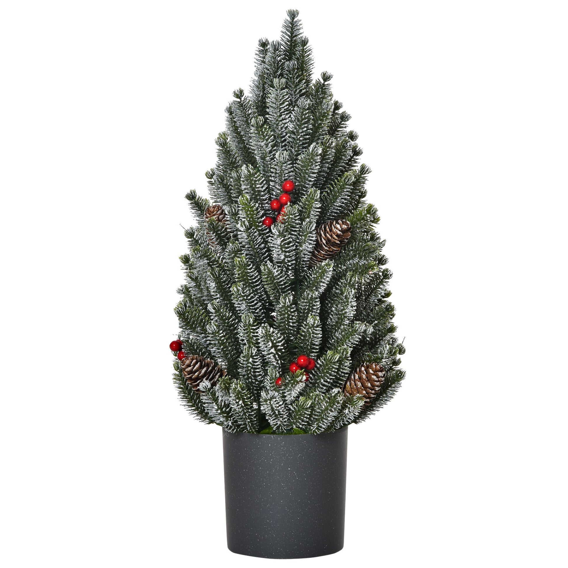 Miniature snow flocked Christmas tree with pinecones and red berries in a black pot for holiday decor