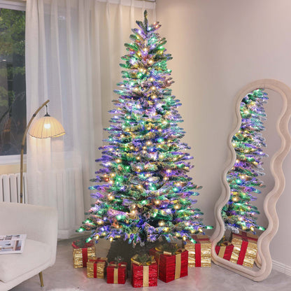 Mountain pine artificial Christmas tree decorated with colorful lights and surrounded by red and gold wrapped gifts