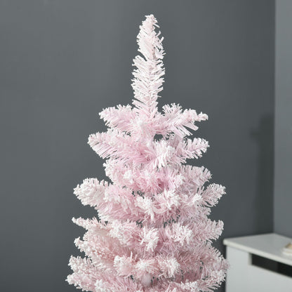 Pink artificial pencil Christmas tree with dense branches against gray wall background
