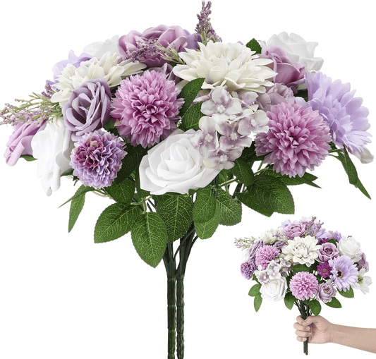 Purple artificial flower arrangement with white and lavender blooms and green leaves from FauxMart.com