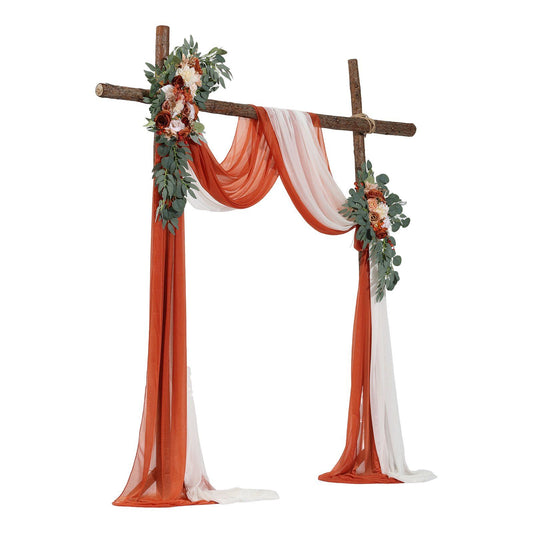 Rustic wedding arch decorated with burnt orange wedding arch flowers and white draped fabric