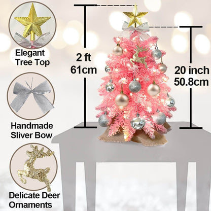 Small Xmas tree for office desk with pink branches, elegant gold star topper, silver bow, and deer ornaments