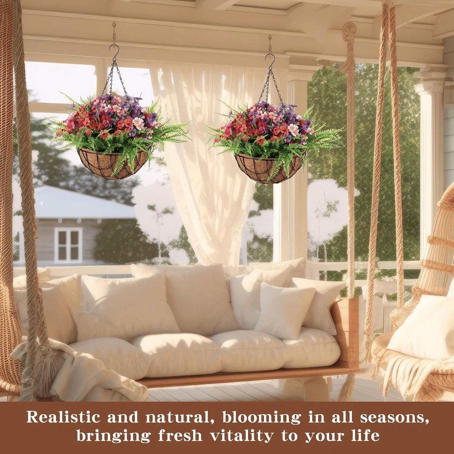 Two artificial hanging flower baskets outdoor with vibrant blooms hanging on porch above cozy sofa