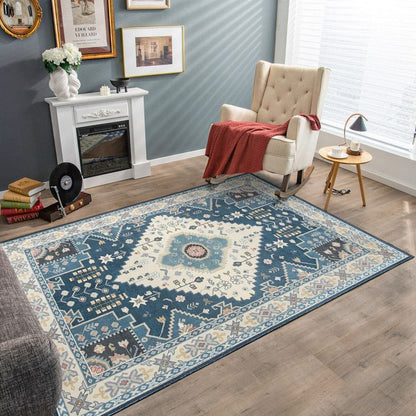 Blue and cream patterned faux wool area rugs in cozy living room with armchair and fireplace
