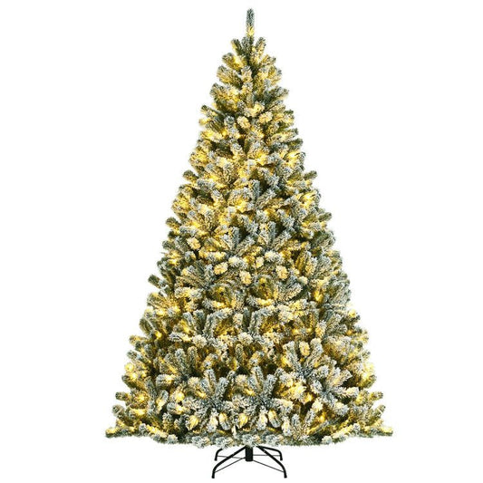 Pre-lit snow flocked Christmas tree with warm white lights and full branches on metal stand