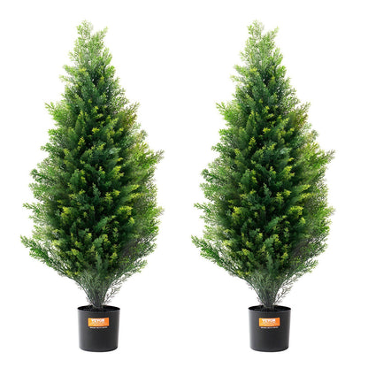 Two artificial cedar topiary trees in black pots from FauxMart.com with lush green foliage
