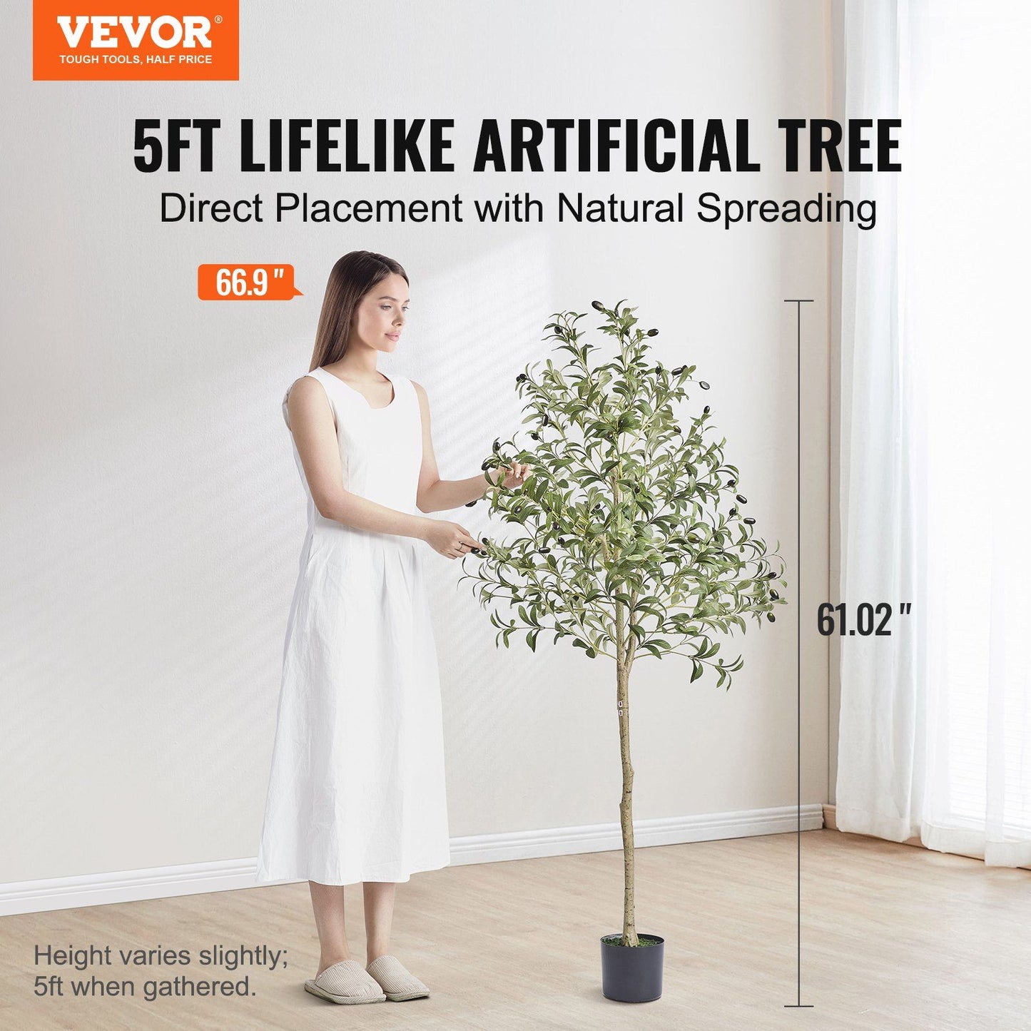 5ft artificial olive tree 5ft with lifelike leaves in black pot next to woman in white dress