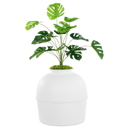 Artificial plant litter box for cats designed to blend with home decor, featuring lush green leaves