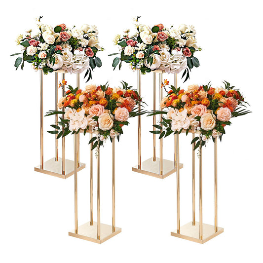 Set of four gold metal wedding flower stands with elegant mixed floral arrangements for events