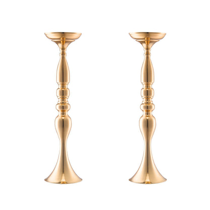 Set of two elegant gold wedding flower stands with a smooth metallic finish and ornate detailing
