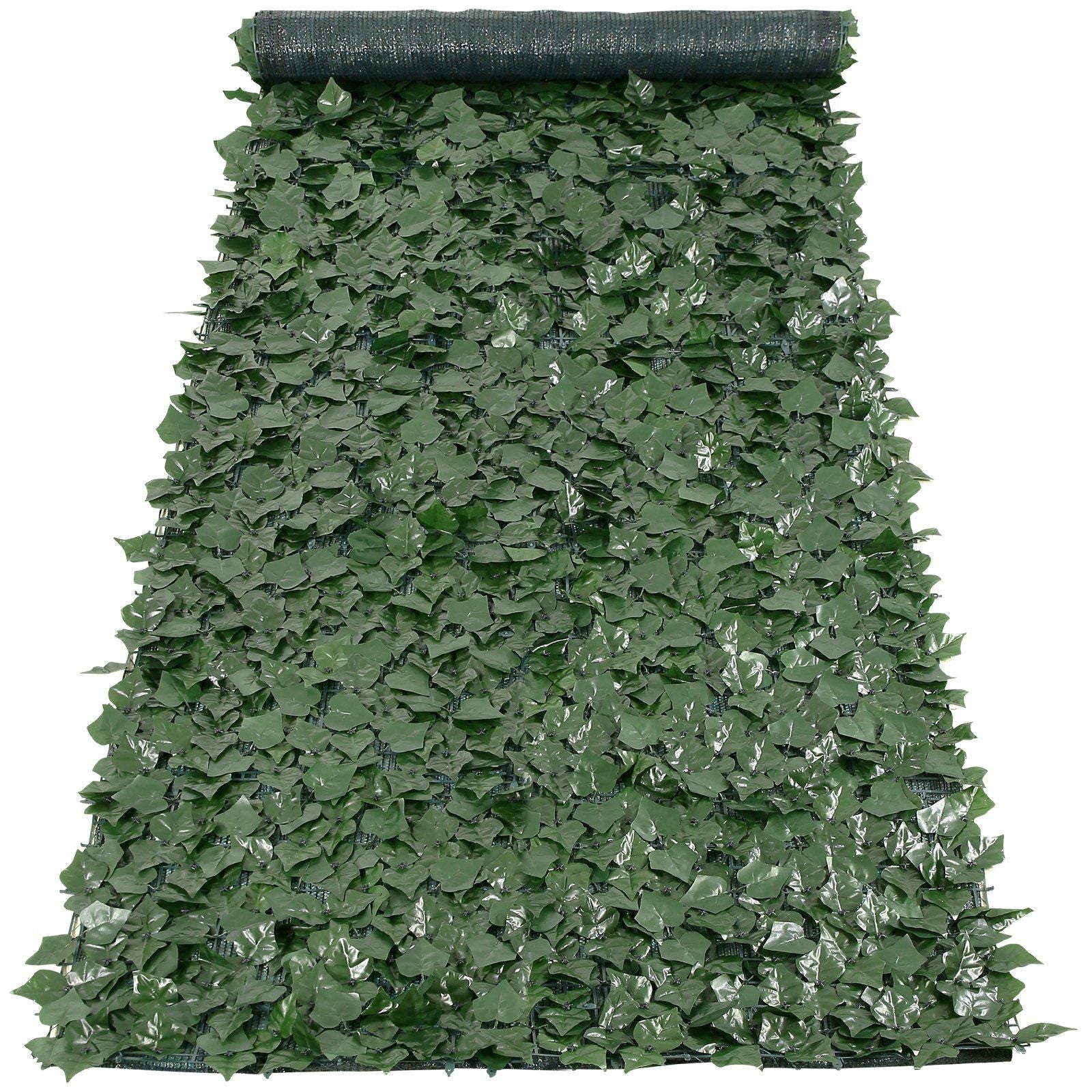 Green foliage privacy screen with mesh backing rolled at the top for easy installation