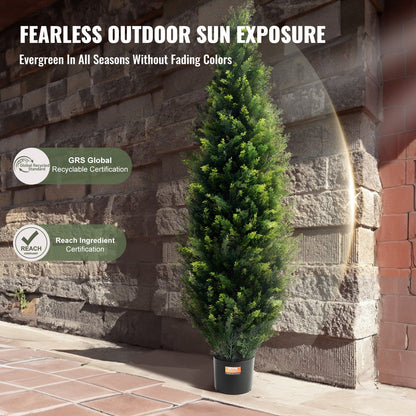 Tall green UV resistant faux plants outdoor in black pot against stone wall at FauxMart.com