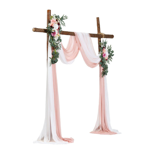 Rustic wooden wedding arch draped with pink and white fabric and decorated with artificial wedding arch flowers kit